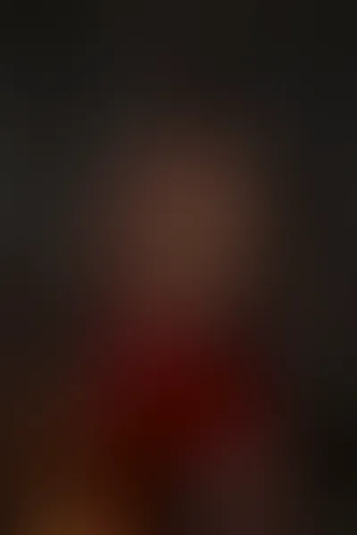 AI after the fight sample — photograph of a woman, framed from mid-thigh up with the cam